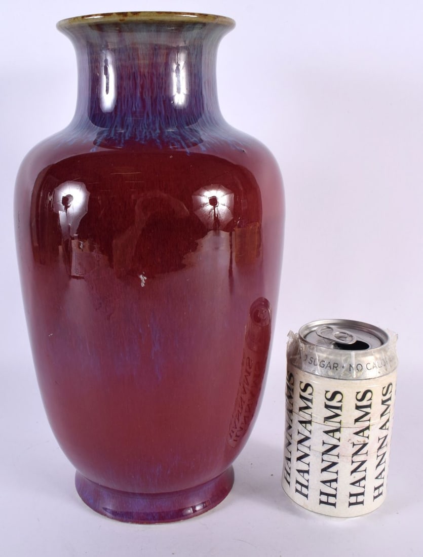 A CHINESE QING DYNASTY FLAMBE GLAZED PORCELAIN VASE bearing Yongzheng marks to base. 30cm high. (1 of 4)