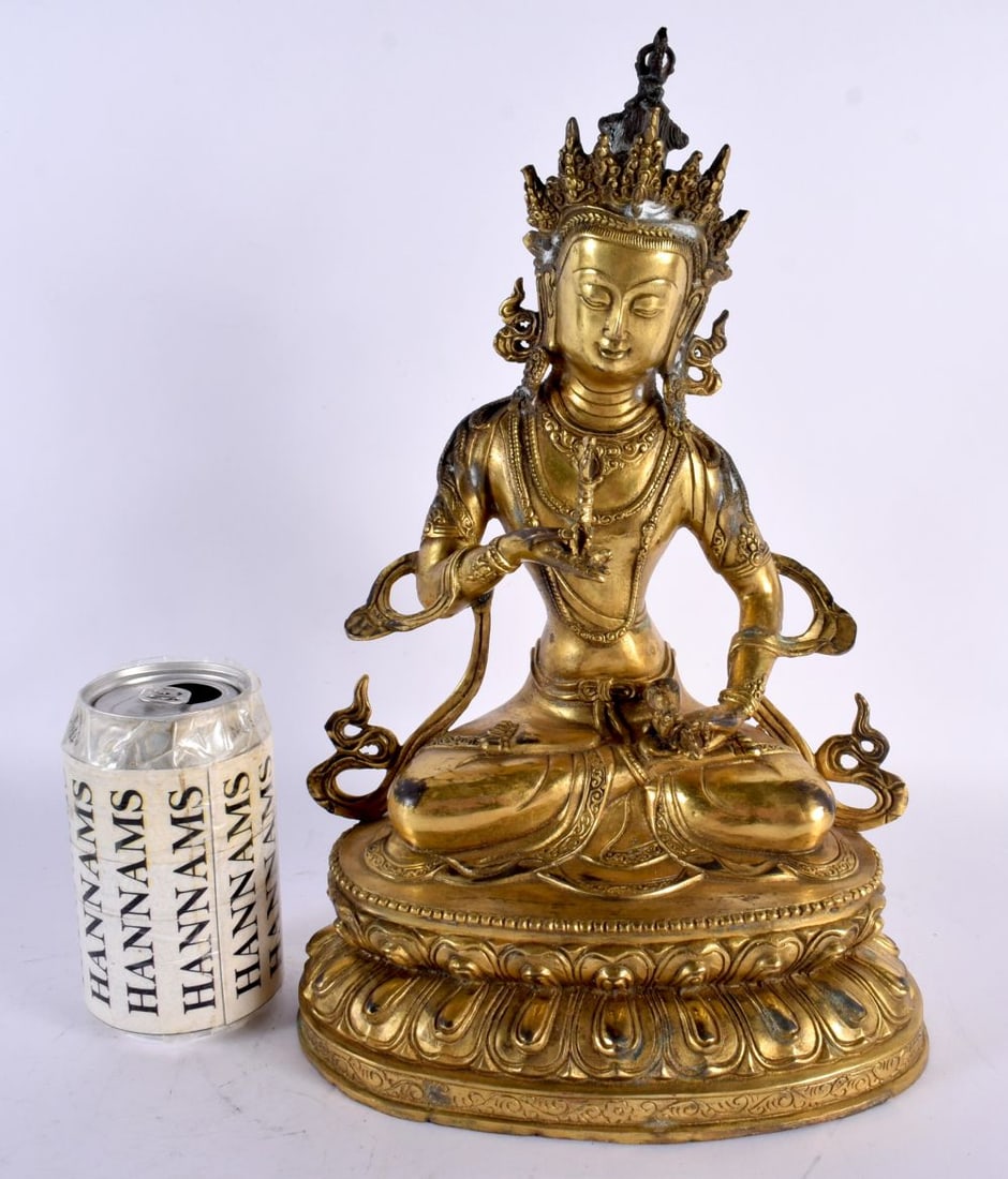 A LARGE CHINESE GILT BRONZE FIGURE OF A SEATED AMITAYUS possibly late Qing, modelled holding a stupa (1 of 7)