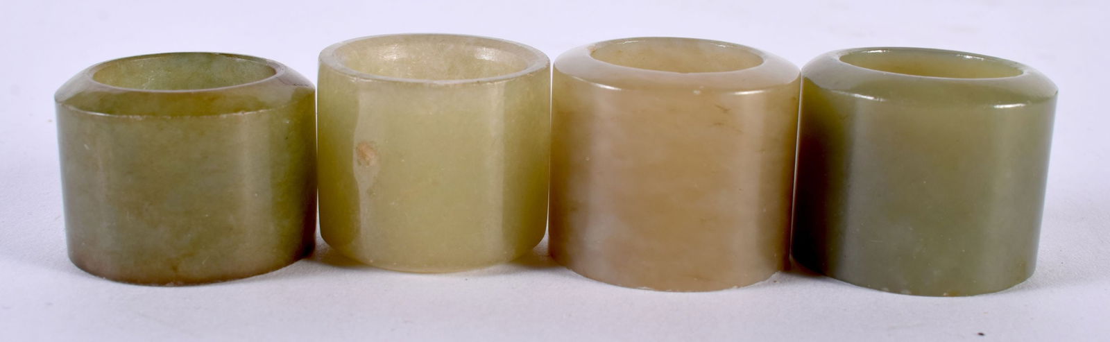 FOUR CHINESE CARVED GREEN JADE ARCHER'S RING. 97 grams. S/V. (4) (1 of 3)