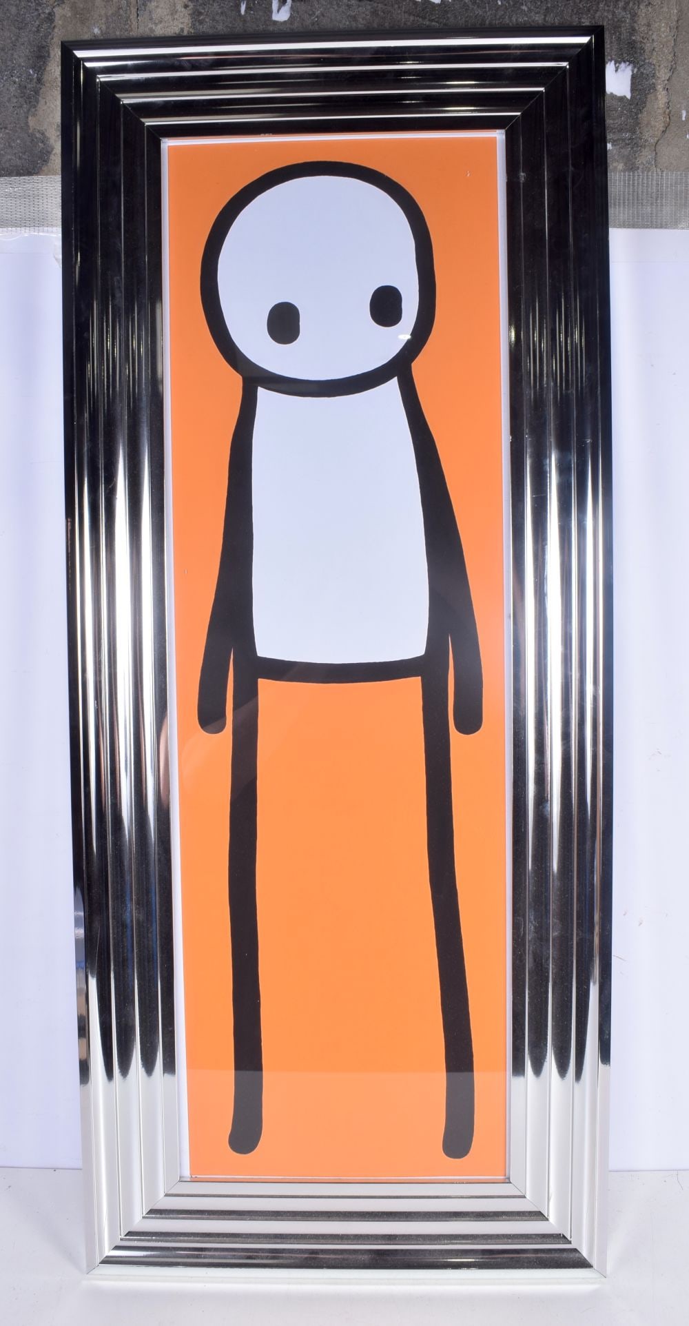 A framed picture of a Stikman 88 x 28 cm.: A framed picture of a Stikman 88 x 28 cm.