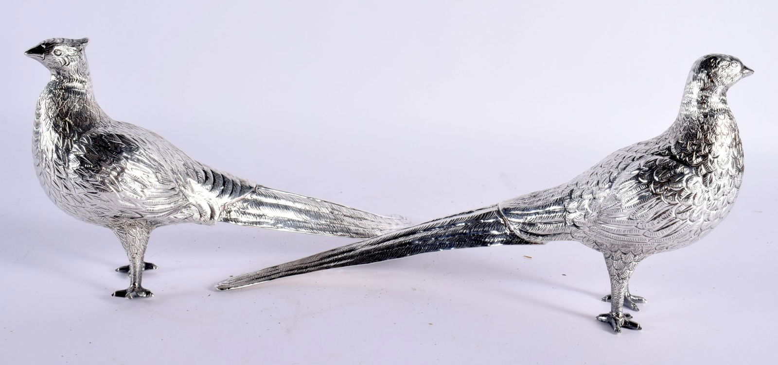 A PAIR OF SOUTH AMERICAN PERUVIAN SILVER MODELS OF PHEASANTS modelled with naturalistic long flowing (1 of 6)