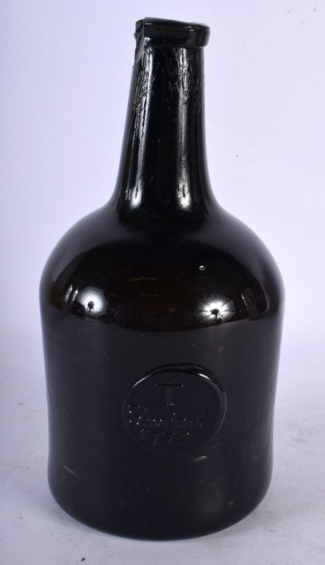 AN 18TH CENTURY ENGLISH WINE BOTTLE bearing seal mark to front T Shortland 1772. 22 cm high.: AN 18TH CENTURY ENGLISH WINE BOTTLE bearing seal mark to front T Shortland 1772. 22 cm high.