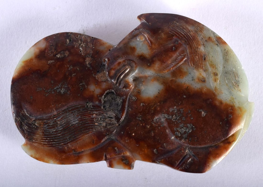 A CHINESE RUSSET JADE HORSE BELT BUCKLE. 40.5 grams. 7 cm x 4.75 cm. (1 of 2)