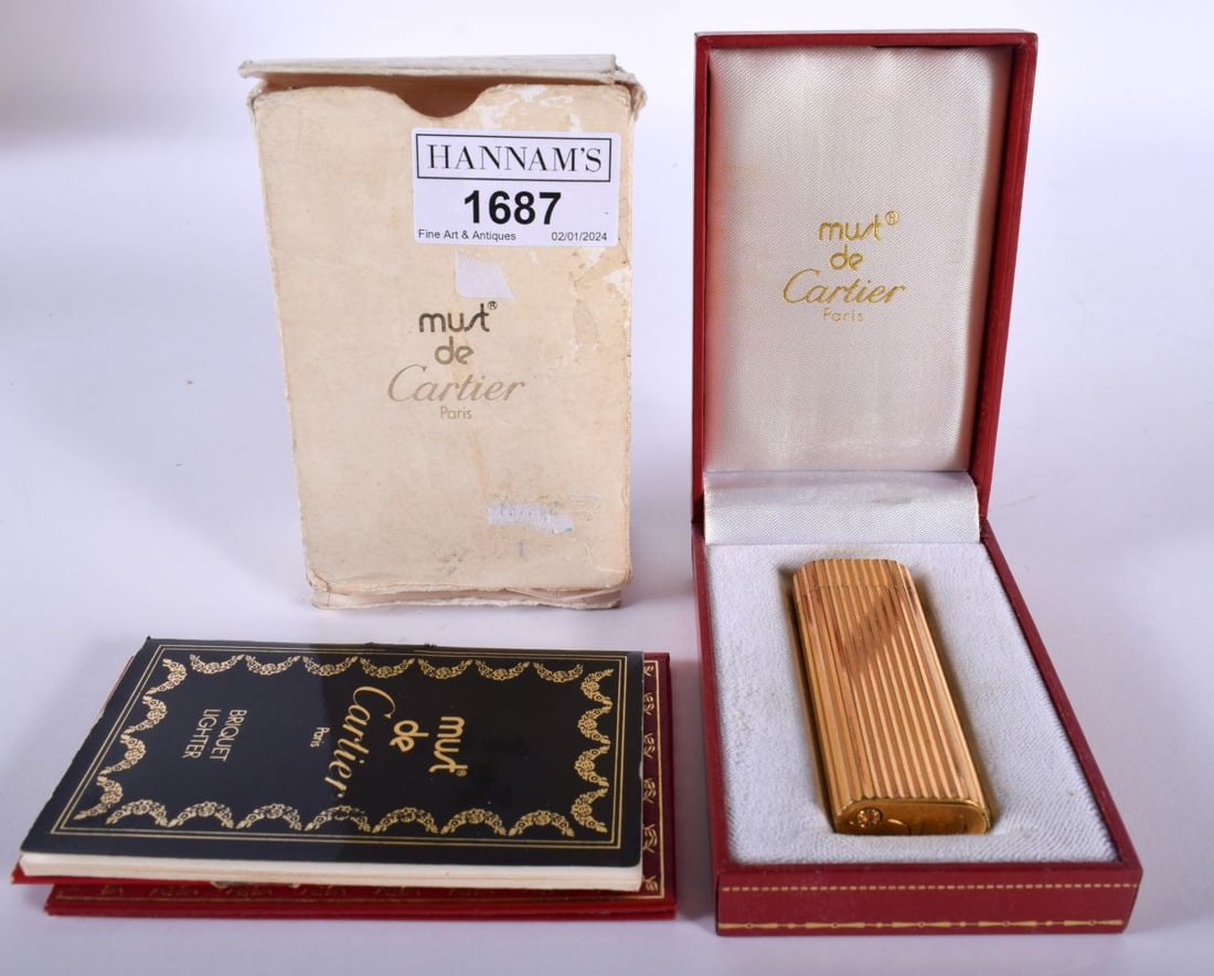 A Boxed Cartier Lighter.  7cm x 2.3cm x 1cm, weight 83.52g.  Not tested (1 of 5)