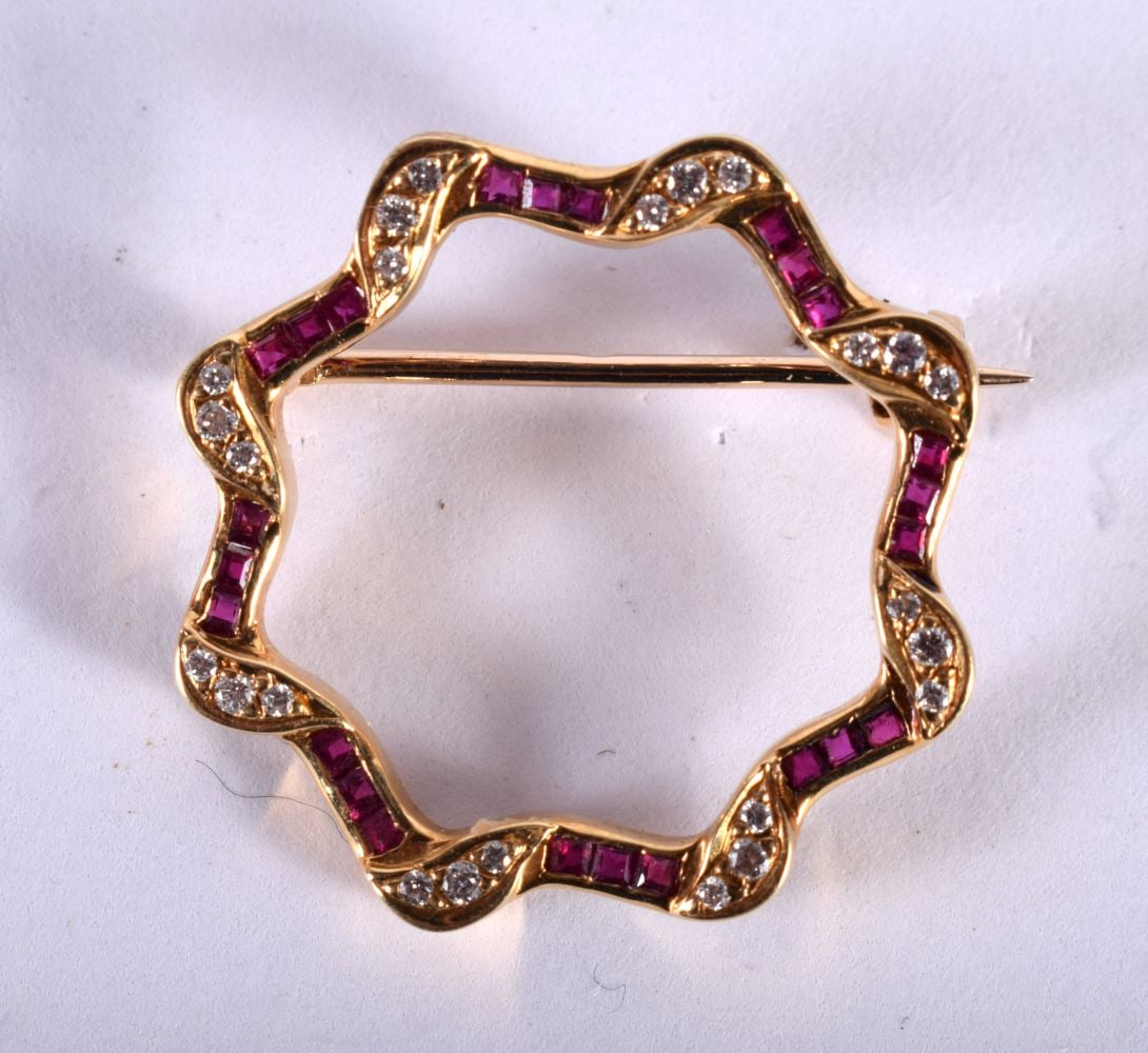 An 18ct Gold, Diamond and Ruby Brooch.  Stamped 750, 2.4cm diameter, weight 4.17g (1 of 2)