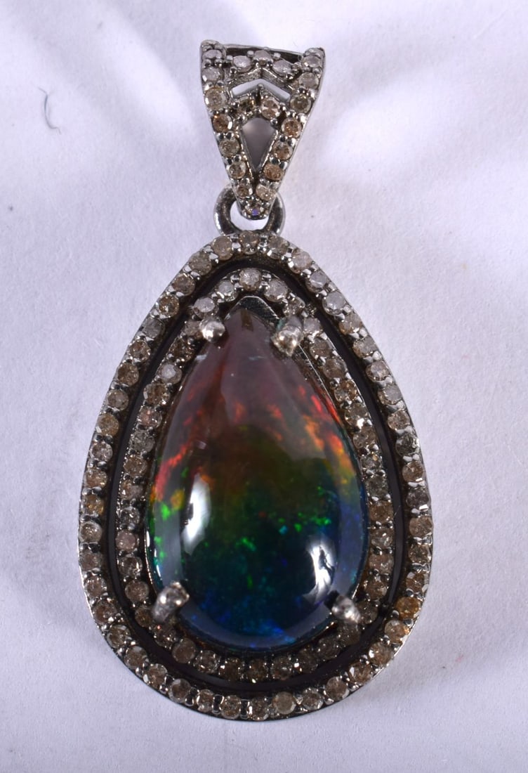 A Diamond and Black Opal,Pendant.  3.4cm x 1.8cm, weight 4.9g (1 of 2)