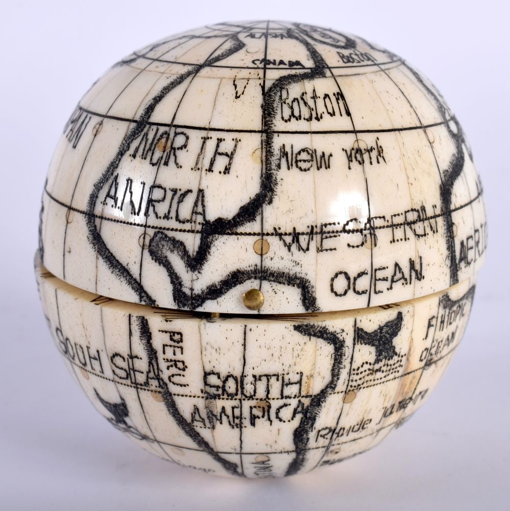 A Bone Globe with a Compass insert. 7cm x 7cm x 7cm: A Bone Globe with a Compass insert. 7cm x 7cm x 7cm