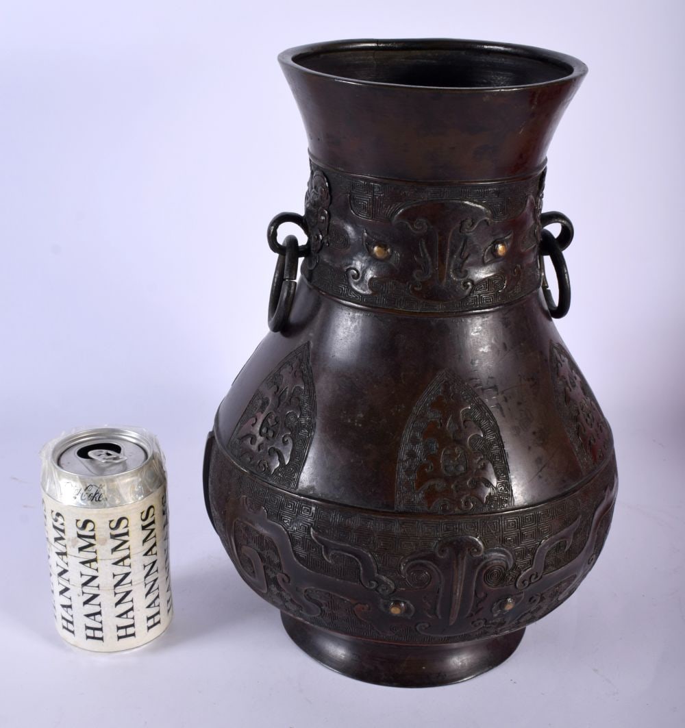 A LARGE CHINESE QING DYNASTY TWIN HANDLED BRONZE VASE decorative with archaic mask heads. 32 cm x 18 (1 of 4)