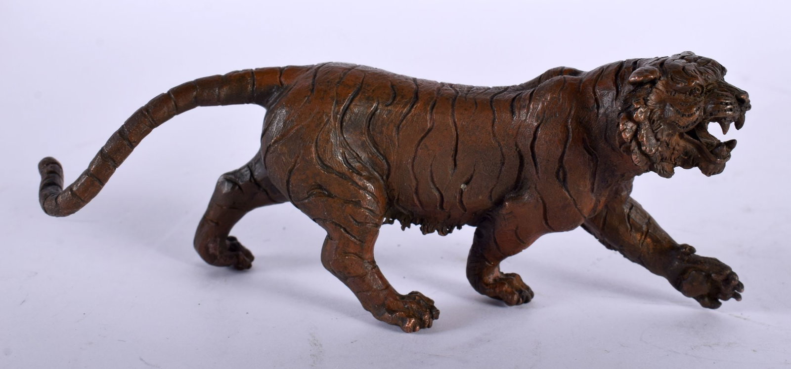 A JAPANESE BRONZE TIGER OKIMONO. 498 grams. 15 cm x 5 cm.: A JAPANESE BRONZE TIGER OKIMONO. 498 grams. 15 cm x 5 cm.