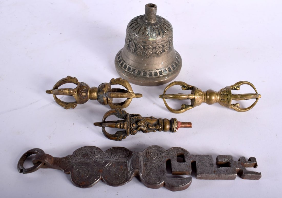 A PAIR OF 18TH CENTURY TIBETAN BRONZE PHURBA together with a similar bell & key form iron pendant. L (1 of 6)