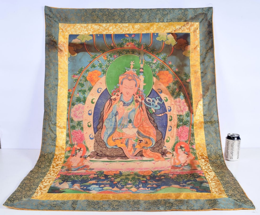 A Tibetan silk Tanka 111 x 80 cm.: A Tibetan silk Tanka 111 x 80 cm.