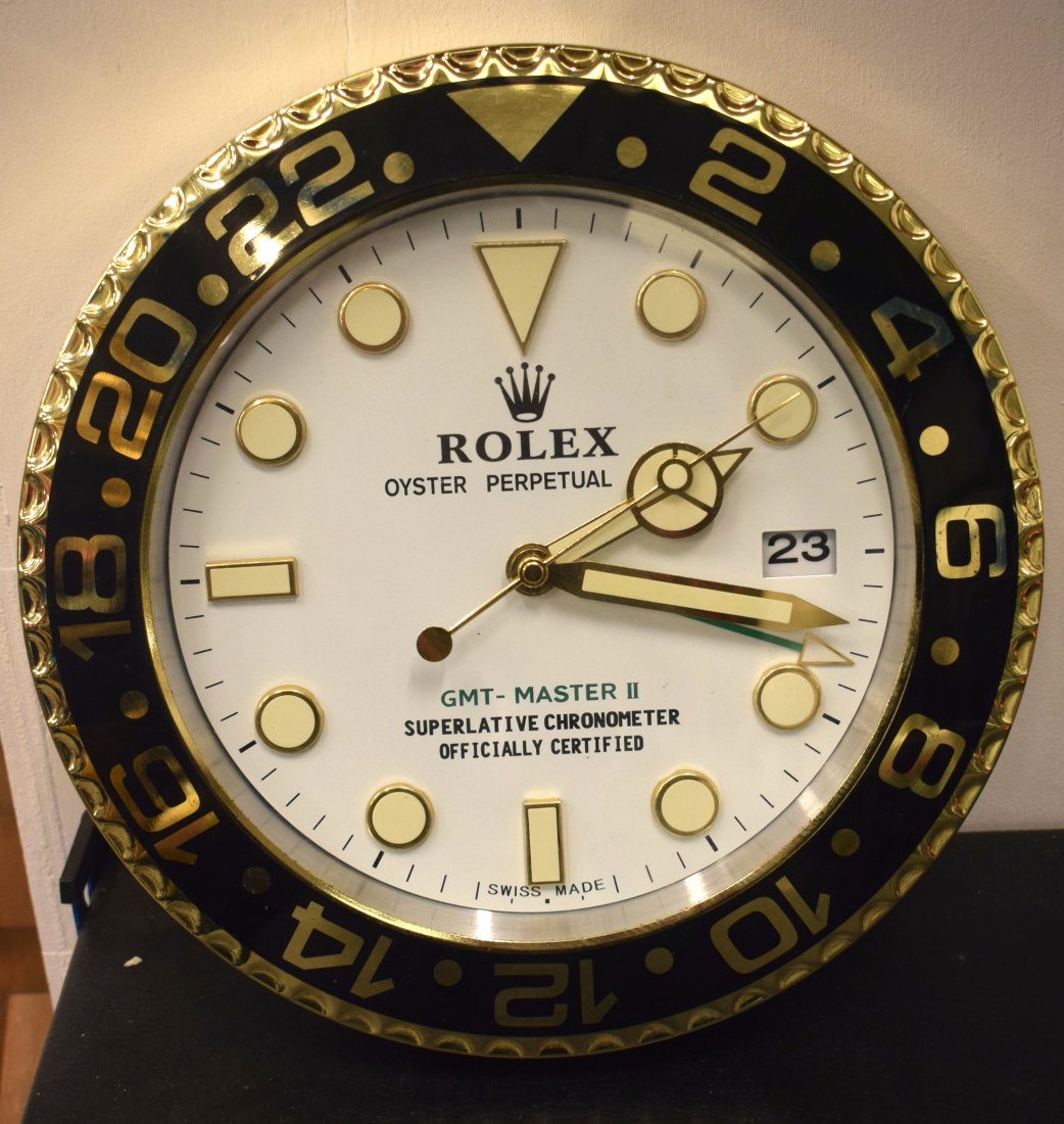 A Contemporary Rolex wall clock 34 cm. (1 of 2)