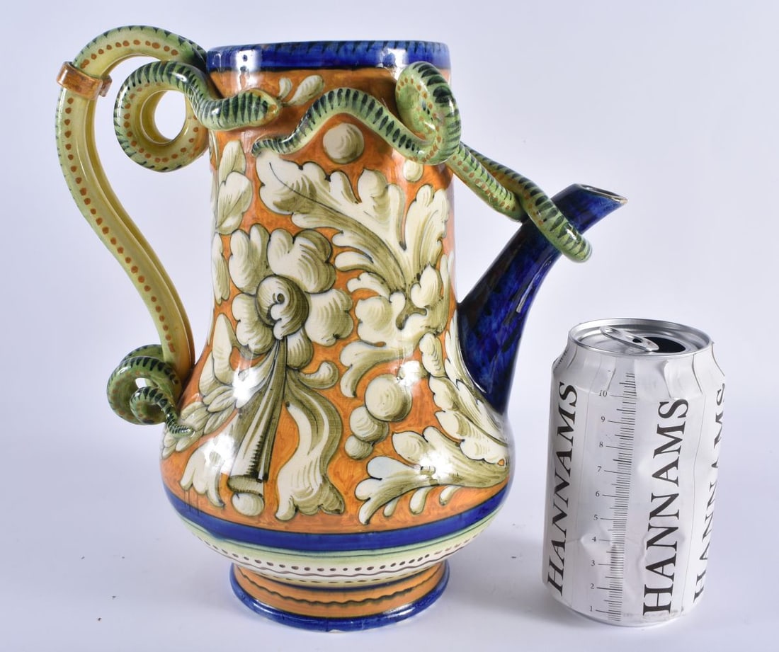 AN ITALIAN MAJOLICA FAIENCE SERPENT JUG painted with floral sprays. 24 cm x 17 cm. (1 of 6)