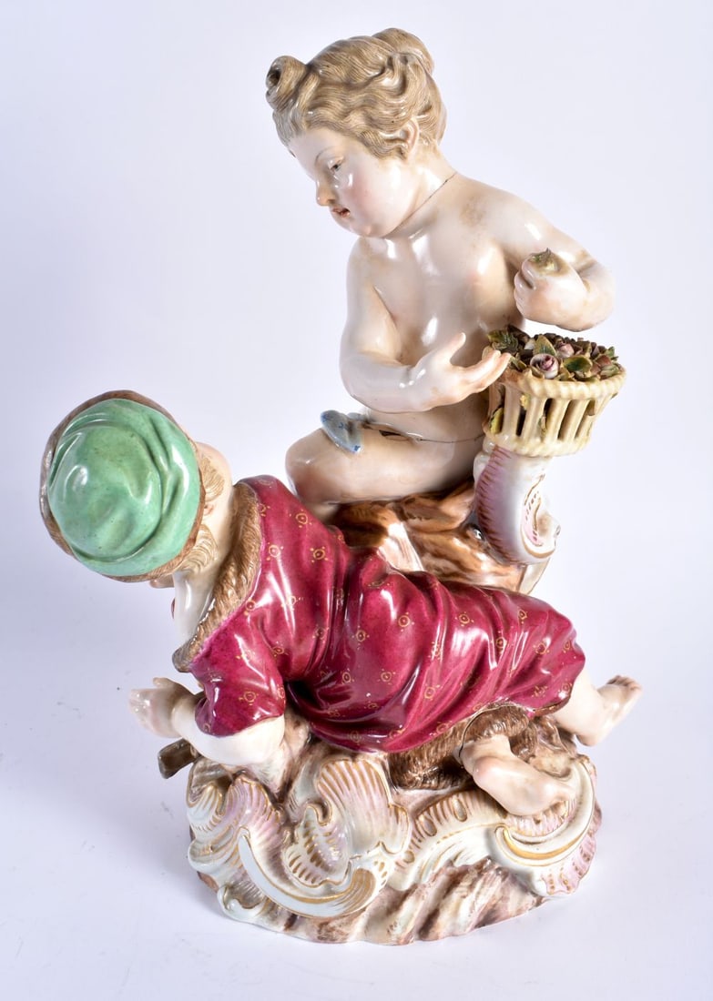 A LARGE 19TH CENTURY MEISSEN PORCELAIN FIGURAL GROUP modelled as two children upon a rocky outcrop. (1 of 5)