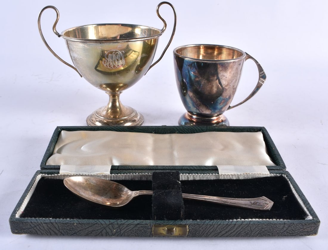 TWO SILVER CUPS and a silver spoon. 223 grams. Largest 11.75 cm x 12.75 cm. () (1 of 8)