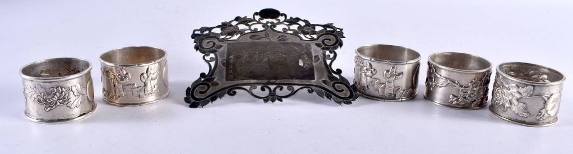 A 19TH CENTURY CHINESE EXPORT SILVER PLAQUE and five Chinese silver napkin rings. 187 grams. Largest: A 19TH CENTURY CHINESE EXPORT SILVER PLAQUE and five Chinese silver napkin rings. 187 grams. Largest 12.5 cm x 10.5 cm. (6)