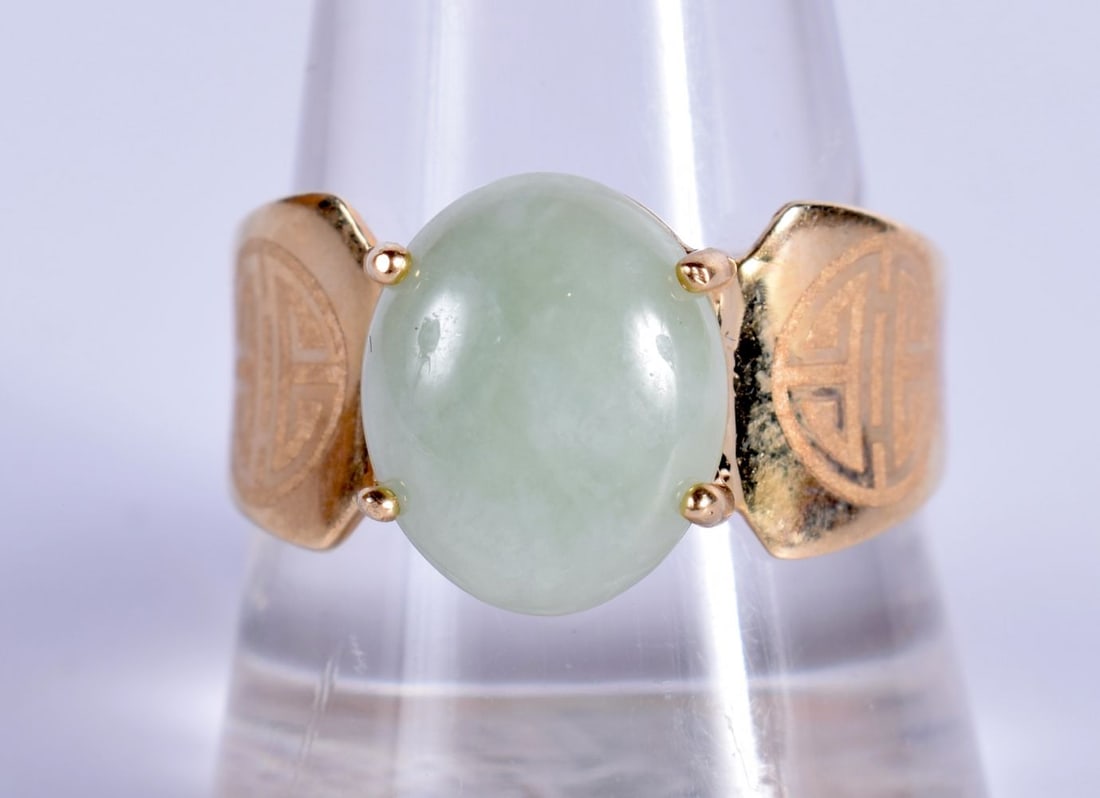 A 14 Carat Gold Ring set with Jade.  Stamped 14K, Ring Size S, weight 5.2g (1 of 3)