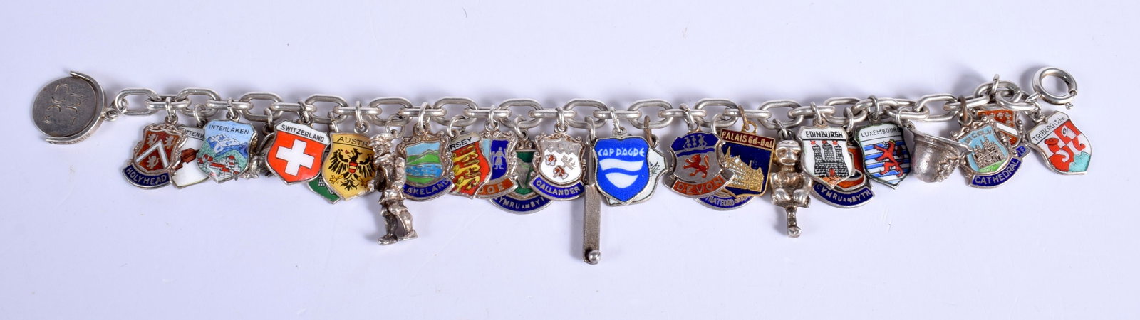A Silver Charm Bracelet with 28 Charms. Marks include Birmingham 1965, length 19cm, weight 51g: A Silver Charm Bracelet with 28 Charms. Marks include Birmingham 1965, length 19cm, weight 51g