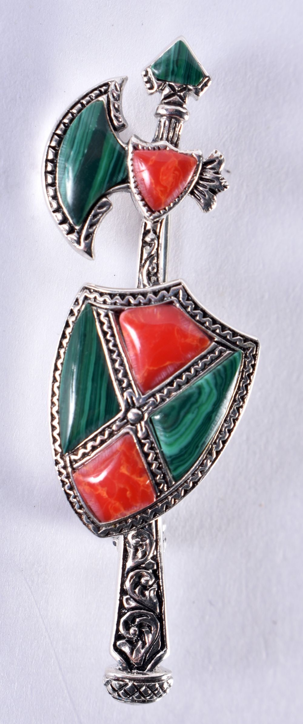 A Silver Axe and Shield Brooch. Stamped Silver, 5.5cm x 1.7cm, weight 7.2g: A Silver Axe and Shield Brooch. Stamped Silver, 5.5cm x 1.7cm, weight 7.2g