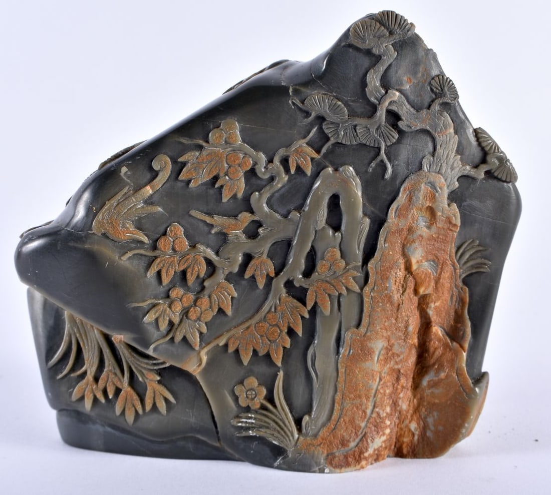 A FINE 19TH CENTURY CHINESE CARVED STONE MOUNTAIN BOULDER Qing, depicting a bird in flight amongst r: A FINE 19TH CENTURY CHINESE CARVED STONE MOUNTAIN BOULDER Qing, depicting a bird in flight amongst rocks. 12 cm x 12 cm.