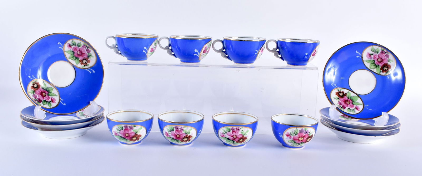 A SET OF EIGHT 19TH CENTURY RUSSIAN KUZNETSOV PORCELAIN CUPS AND SAUCERS painted with floral sprays (1 of 9)
