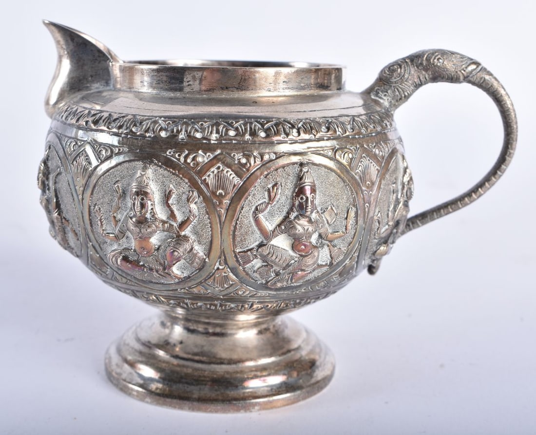 AN ANTIQUE INDIAN SILVER CREAM JUG. 143 grams. 12 cm x 8.5 cm. (1 of 6)