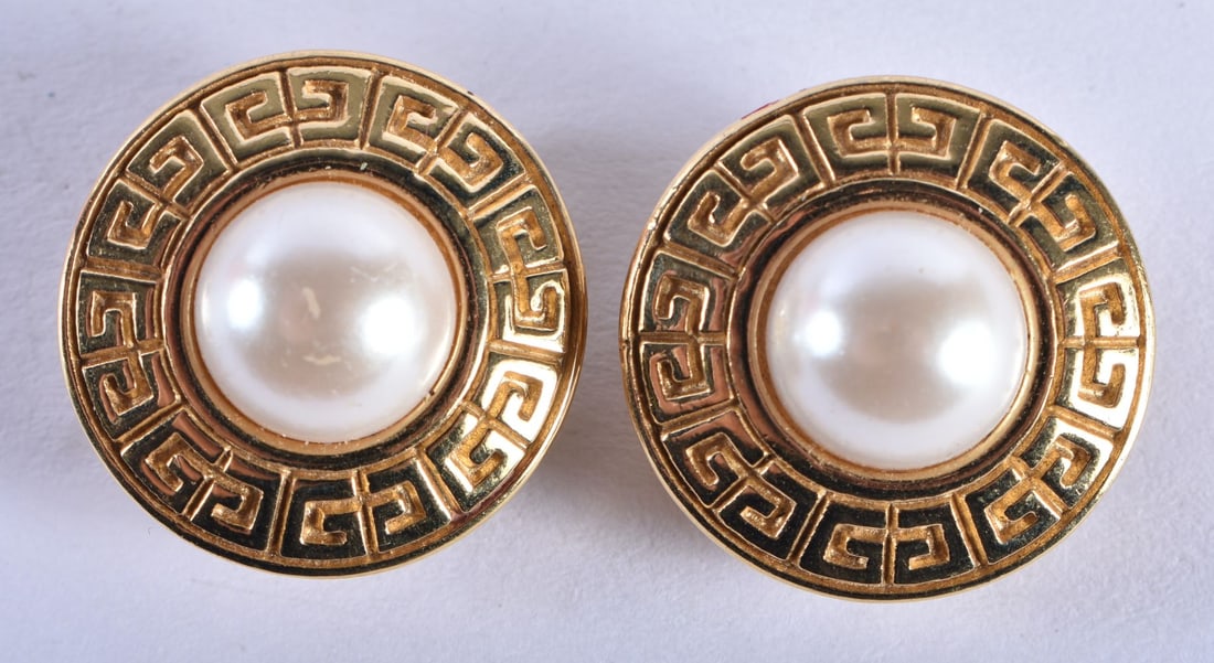 A pair of gold tone faux pearl clip on earrings by Givenchy (21g): A pair of gold tone faux pearl clip on earrings by Givenchy (21g)