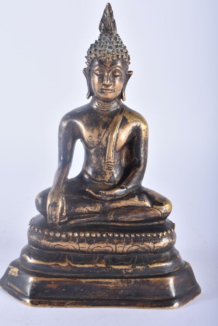 A 19TH CENTURY SOUTH EAST ASIAN THAI INDIAN BRONZE FIGURE OF A BUDDHA modelled seated upon a triangu: A 19TH CENTURY SOUTH EAST ASIAN THAI INDIAN BRONZE FIGURE OF A BUDDHA modelled seated upon a triangular base. 16 cm x 8 cm.