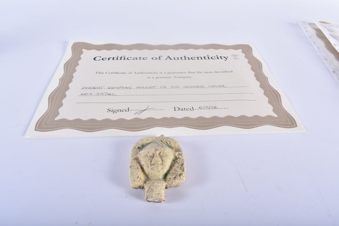 AN ANCIENT EGYPTIAN AMULET OF THE GODDESS HATHOR 664-332 BC. 7.5 cm x 5.5 cm. (1 of 3)