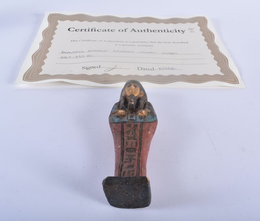 AN ANCIENT EGYPTIAN USHABTI 664-332 BC. 15 cm high.: AN ANCIENT EGYPTIAN USHABTI 664-332 BC. 15 cm high.