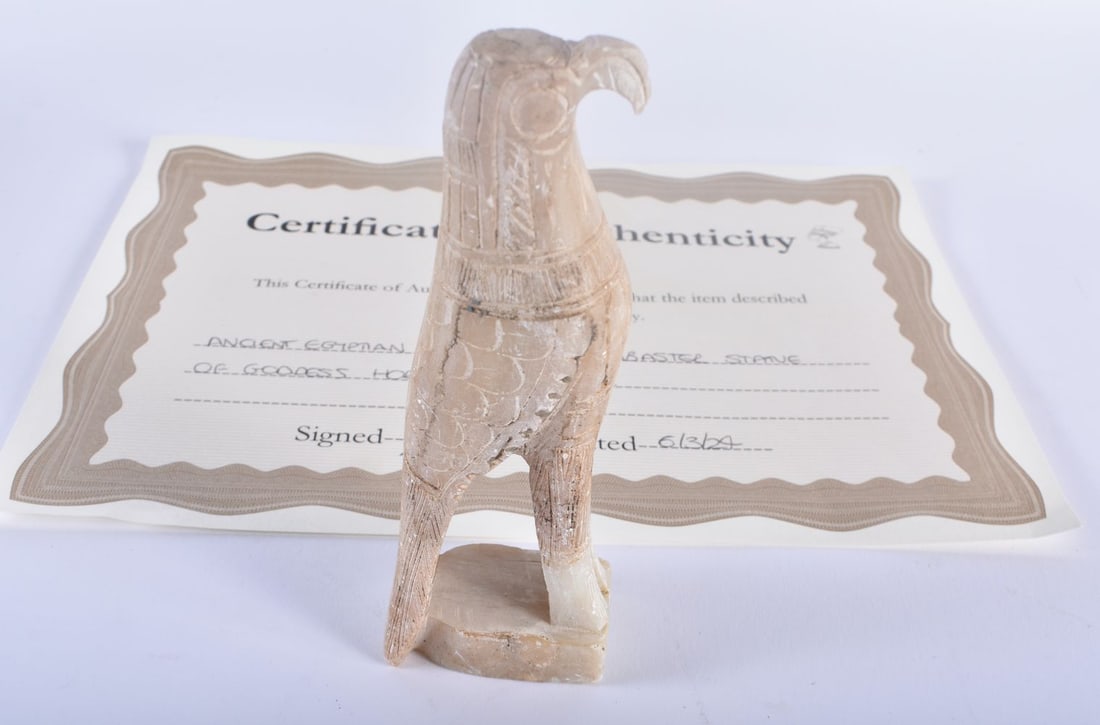 AN ANCIENT EGYPTIAN ALABASTER STATUE OF THE GODDESS HORUS 664-332 BC. 15 cm high. (1 of 4)