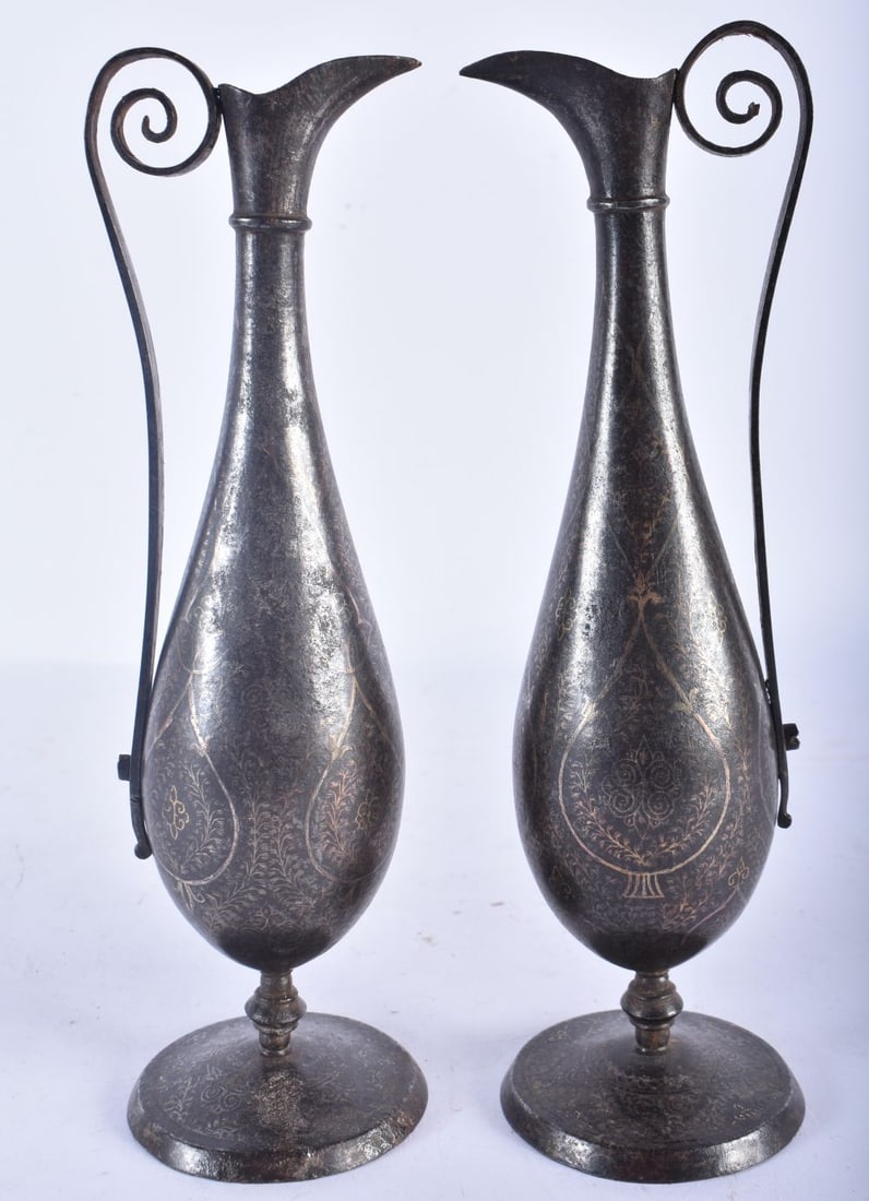 A PAIR OF 19TH CENTURY ISLAMIC PERSIAN MIDDLE EASTERN STEEL EWERS inlaid with gold and silver foliag (1 of 5)