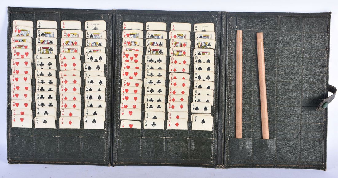 A VINTAGE LEATHER CASED TRAVELLING SOLITAIRE CARD GAME. 24 cm x 15 cm. (1 of 6)