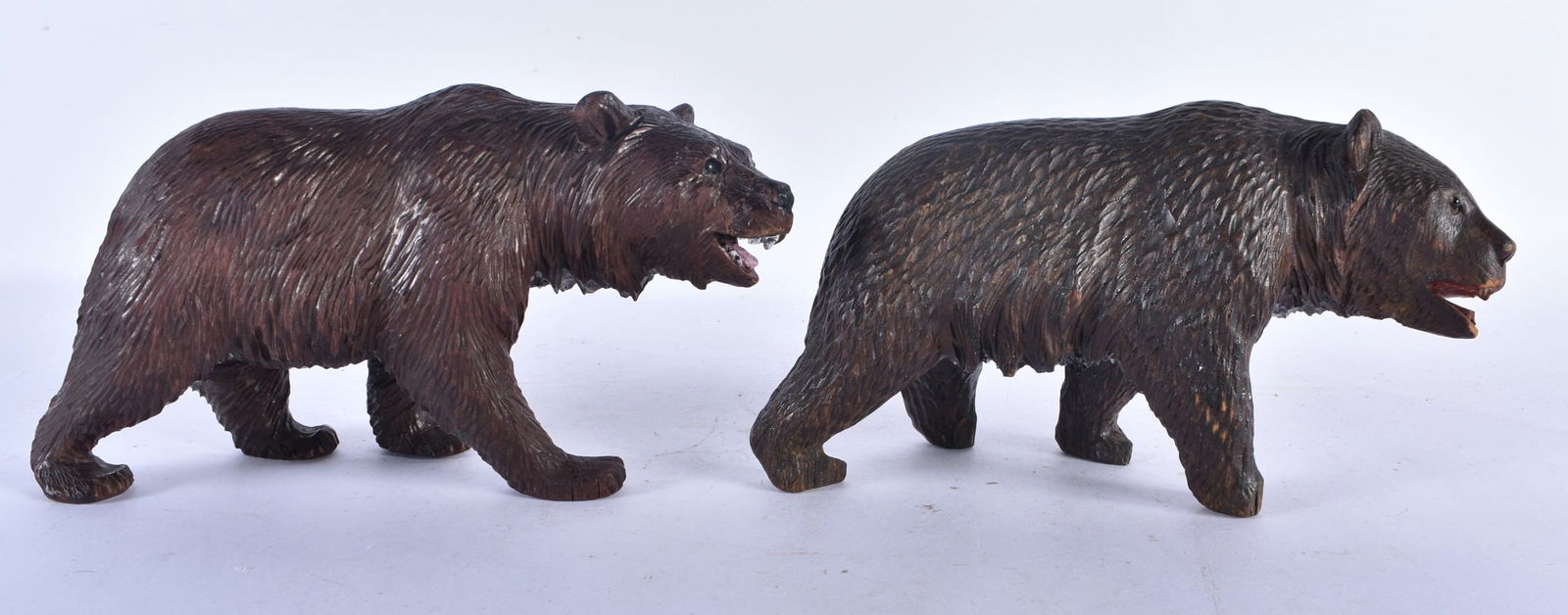 A PAIR OF 19TH CENTURY BAVARIAN BLACK FOREST CARVED WOOD BEARS modelled roaming. 18cm x 10 cm. (1 of 5)