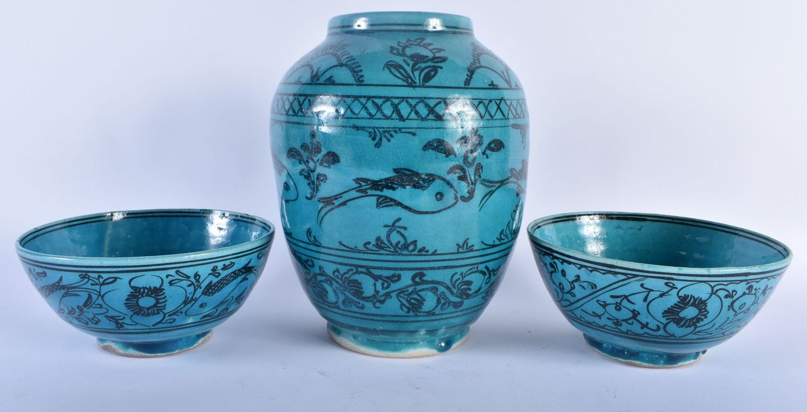 A PERSIAN SAFAVID TURQUOISE GLAZED POTTERY VASE together with a similar bowls. Largest 22 cm x 15 cm (1 of 7)