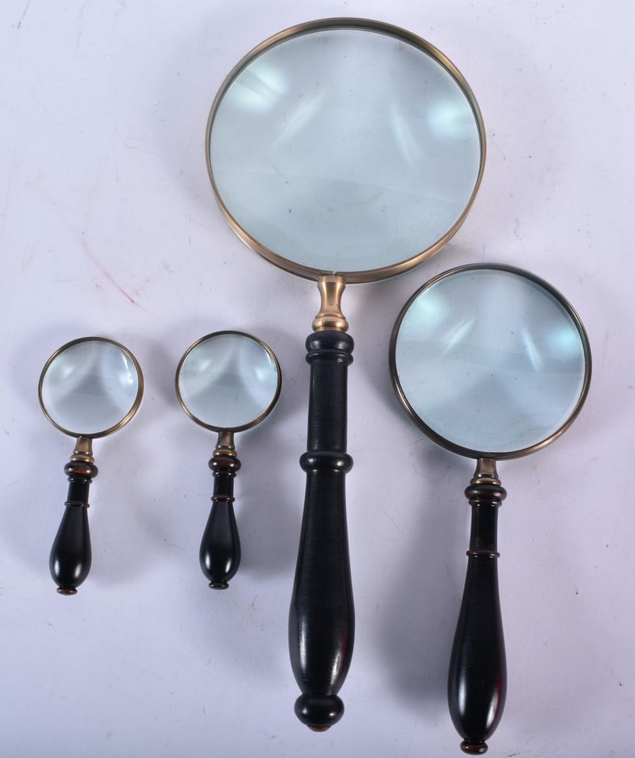 FOUR MAGNIFYING GLASSES. Largest 34 cm long. (4) (1 of 3)