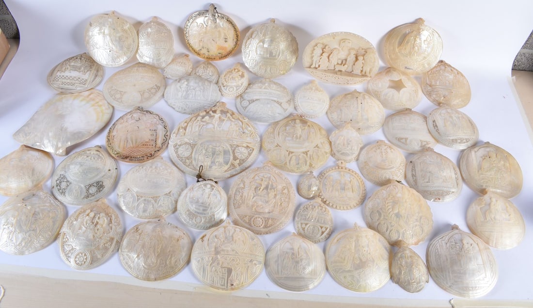 A VERY LARGE COLLECTION OF 19TH CENTURY CONTINENTAL CARVED MOTHER OF PEARL SHELLS in various forms a (1 of 8)
