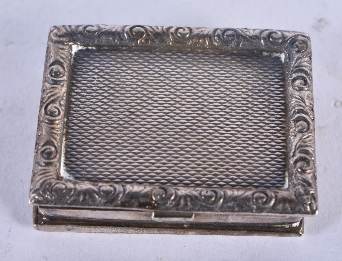 A Silver Pill Box With engine turned decoration and gilt interior by John Charles Lowe, hallmarked L (1 of 3)