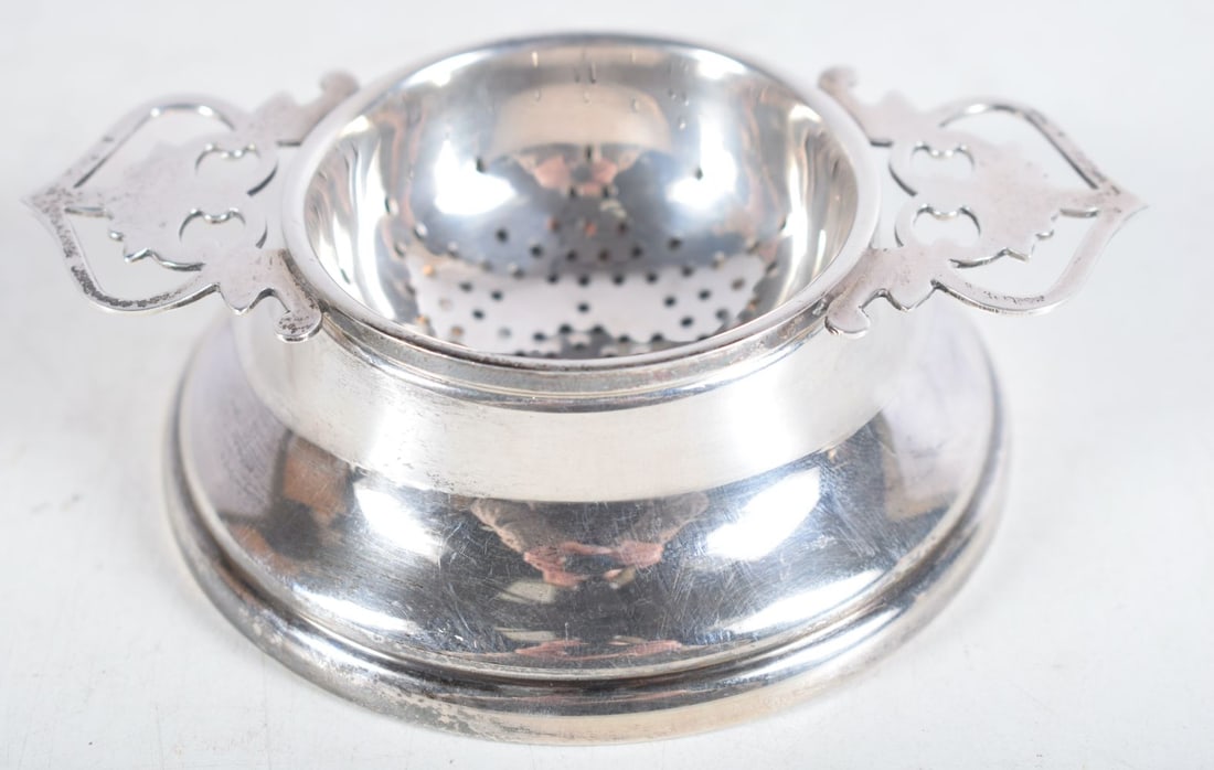 A Vintage Silver Tea Strainer on Stand by Lanson Ltd.  Hallmarked Birmingham 1959.  3 cm x 10.5 cm x (1 of 4)