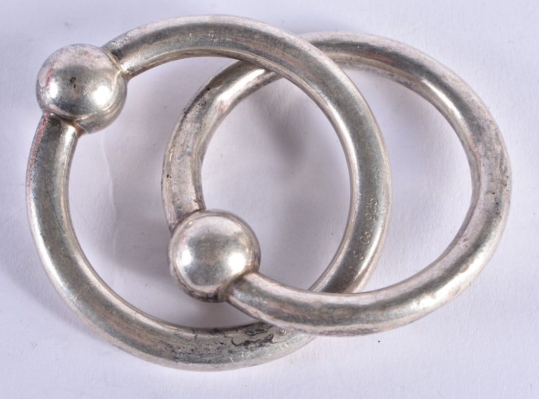 A TIFFANY & CO SILVER BANGLE. 32.1 grams. 9 cm x 5.5 cm. (1 of 3)