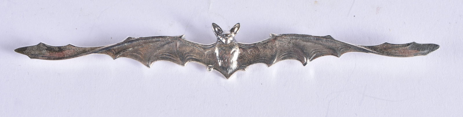 A Silver Bat Brooch. Stamped Sterling. 11.7cm x 1.5 cm, weight 7.1g: A Silver Bat Brooch. Stamped Sterling. 11.7cm x 1.5 cm, weight 7.1g