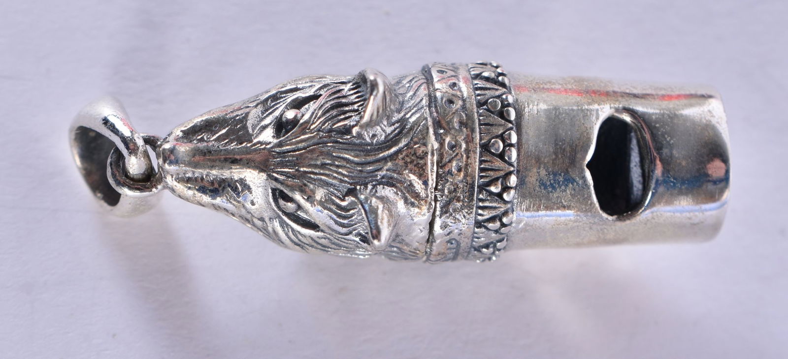 A Silver Wolf Head Whistle Pendant.  Stamped Sterling, 4.6 cm x 1.2 cm x 1.4cm, weight 12.1g (1 of 3)