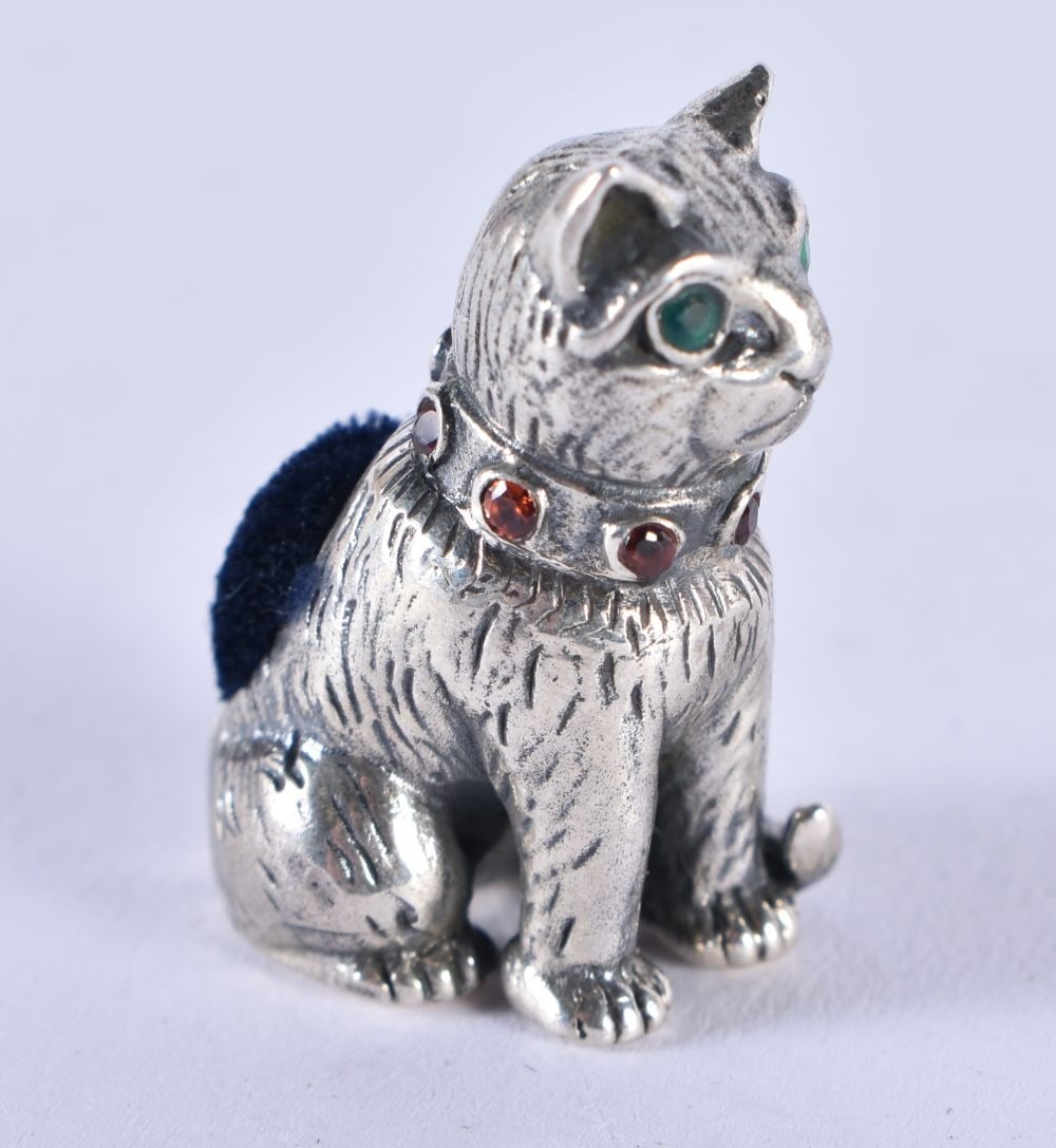 A SILVER CAT PIN CUSHION. 12.8 grams. 2.5 cm x 1.75 cm. (1 of 3)