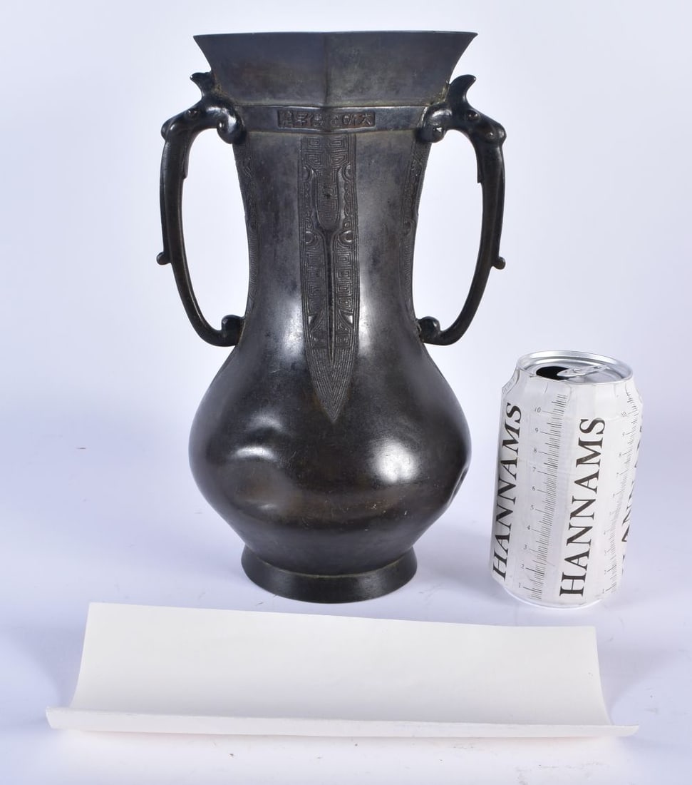 AN UNUSUAL 16TH/17TH CENTURY CHINESE TWIN HANDLED BRONZE VASE bearing Xuande marks to rim, with styl (1 of 11)