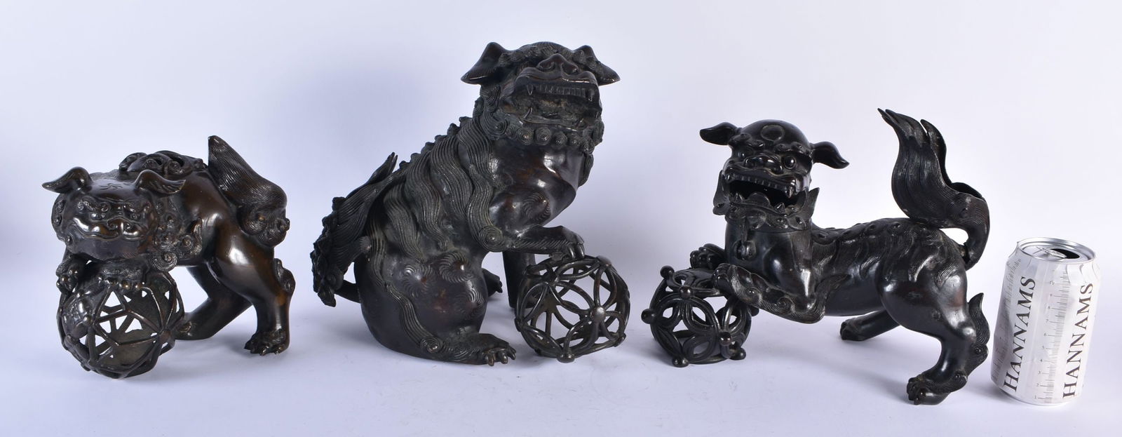 A LARGE 17TH CENTURY CHINESE BRONZE FIGURE OF A BUDDHISTIC LION King, together with two other bronze (1 of 11)