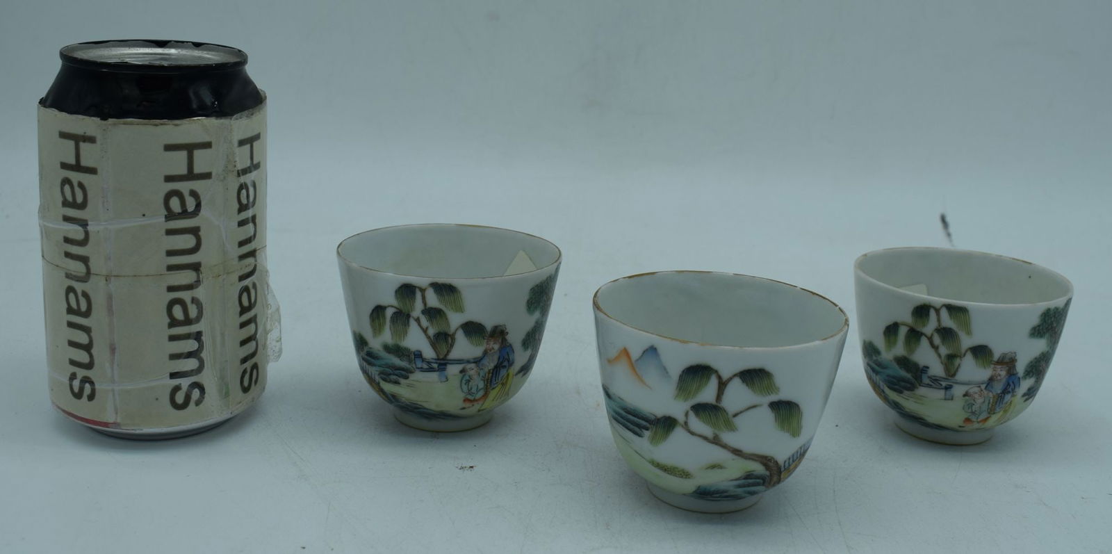Three Chinese porcelain tea bowls decorated with figures in a landscape 6 x 7 cm (3) (1 of 3)
