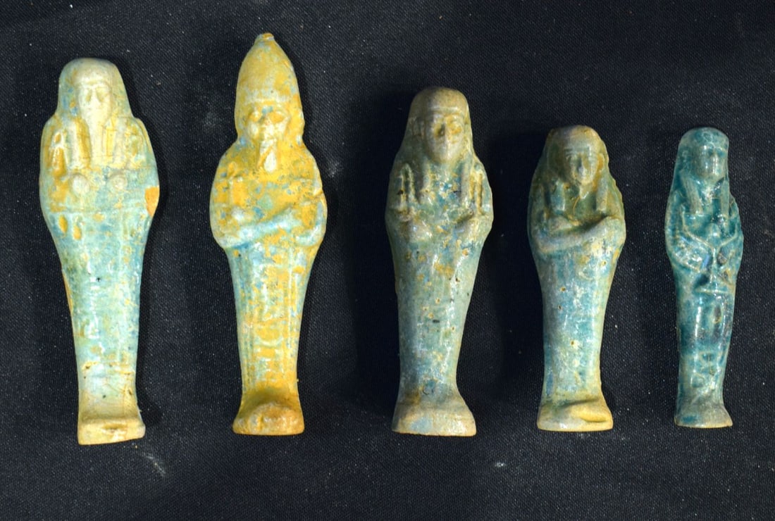A collection of Egyptian glazed pottery Pharaoh largest 12cm (5). (1 of 2)