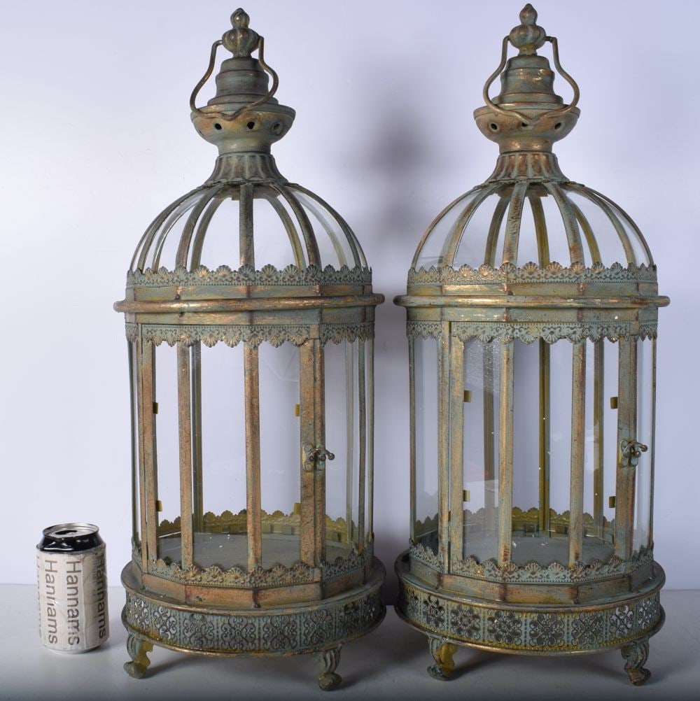 A pair of Islamic style metal and glass lanterns 61 cm (2).: A pair of Islamic style metal and glass lanterns 61 cm (2).