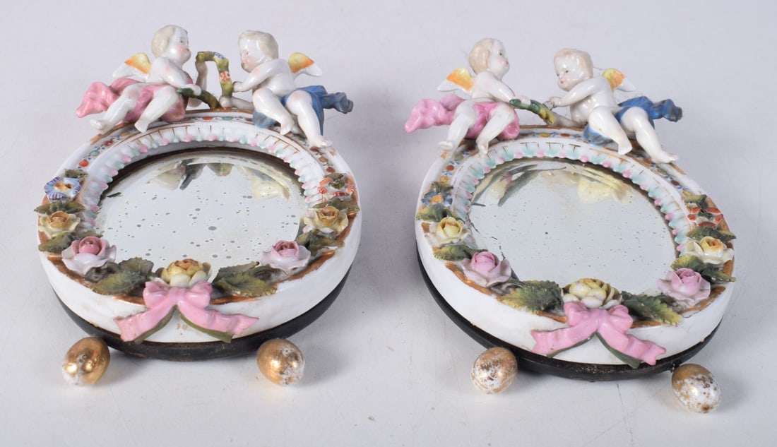 A pair of small Meissen porcelain mirrors 18.5 x 12 cm: A pair of small Meissen porcelain mirrors 18.5 x 12 cm