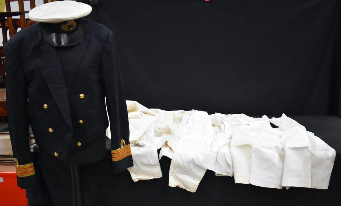 A Royal Navy dress uniform together with a cap and a selection of trousers, shirts,collars etc (Qty) (1 of 8)